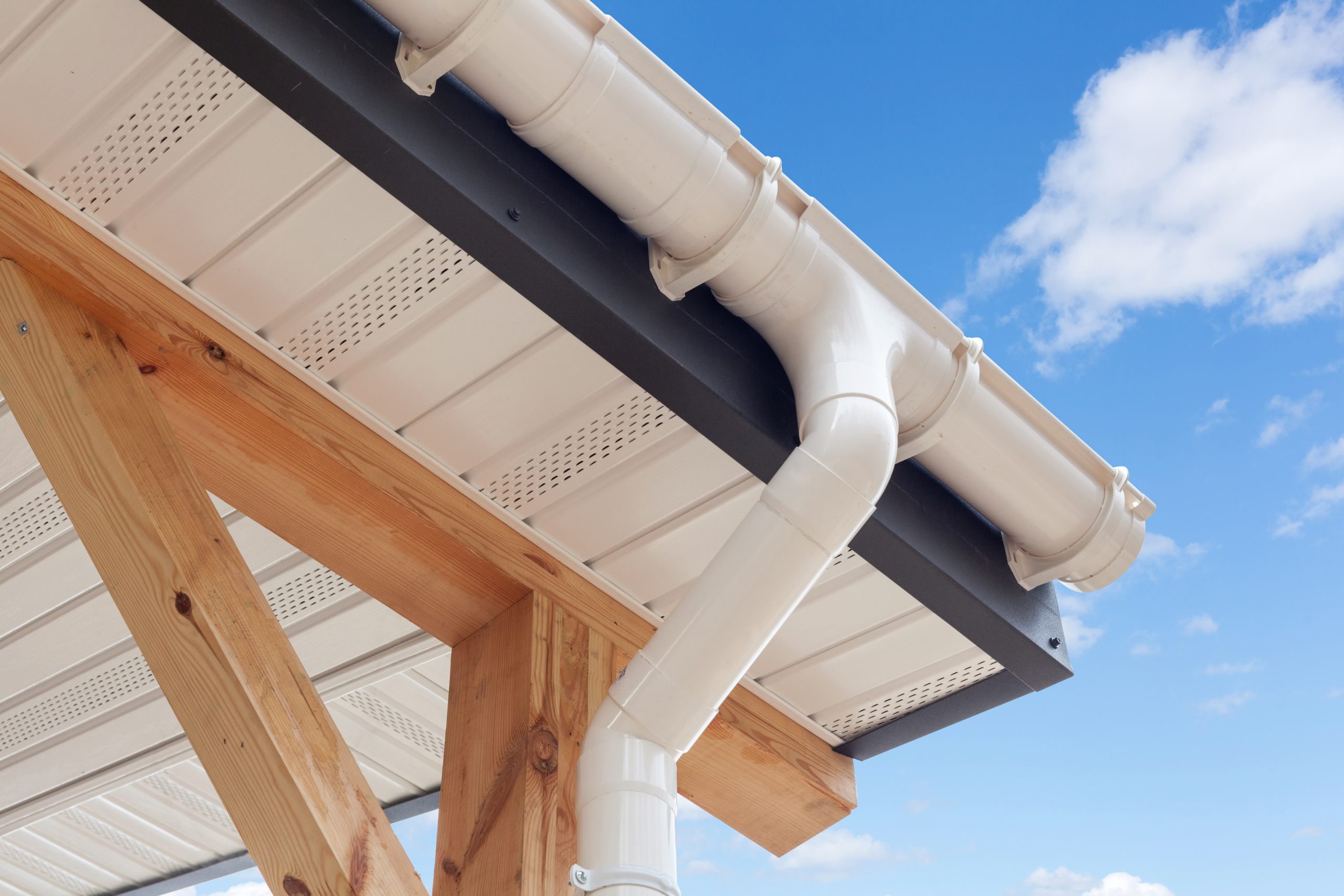 Roof with white new gutter installation near me